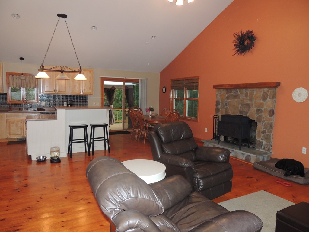 52 Ayers Road Monson, MA 01057 - Photo 11 of 25 a living room with furniture a dining table and a fireplace