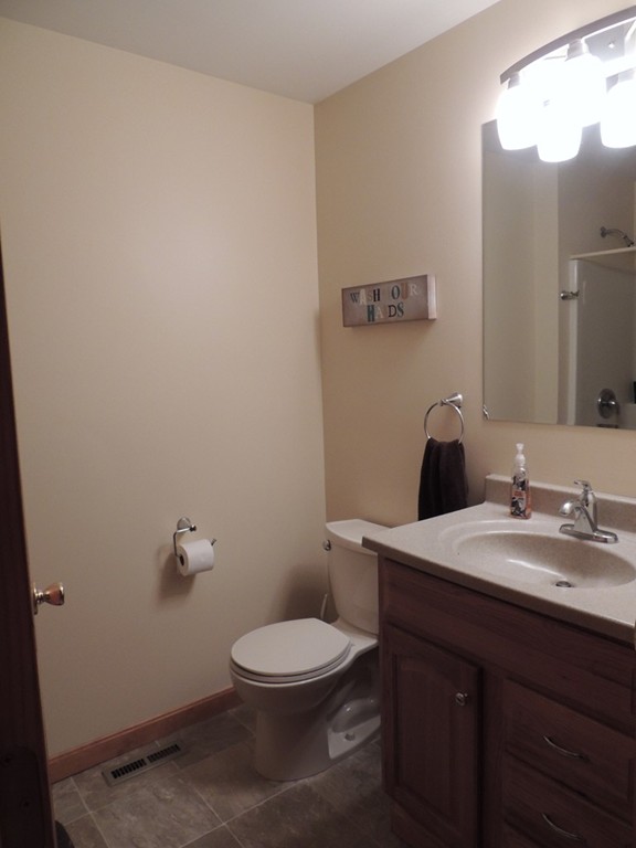 52 Ayers Road Monson, MA 01057 - Photo 13 of 25 a bathroom with a toilet a sink and mirror