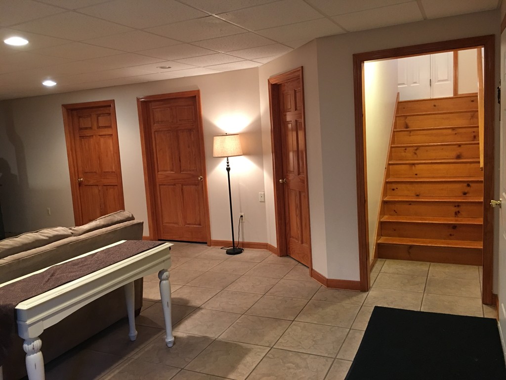 52 Ayers Road Monson, MA 01057 - Photo 16 of 25 a view of a hallway with entryway and stairs