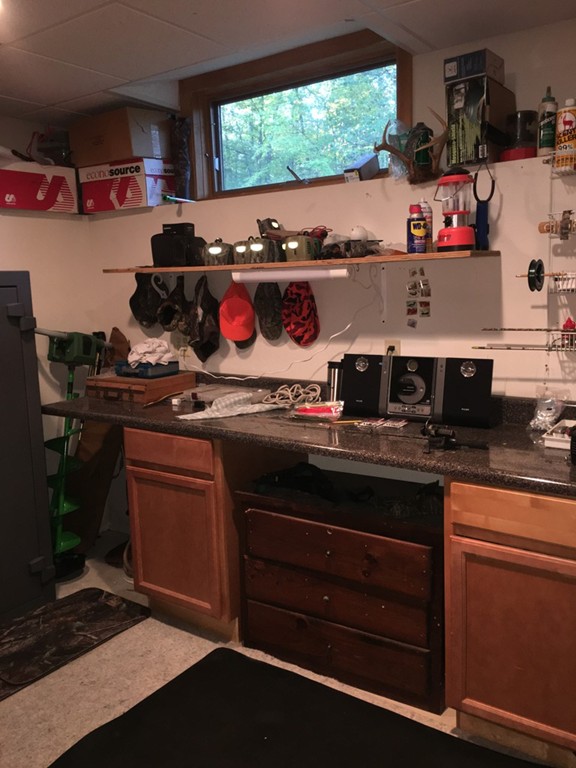 52 Ayers Road Monson, MA 01057 - Photo 18 of 25 a kitchen with a stove and cabinets