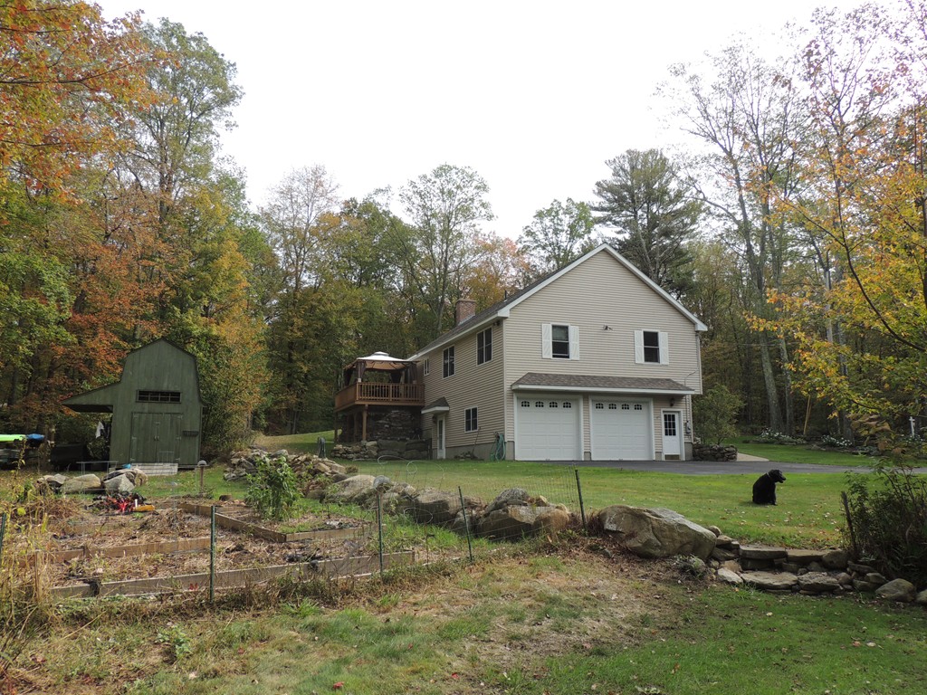 52 Ayers Road Monson, MA 01057 - Photo 25 of 25 a view of a white house with a yard and large tree