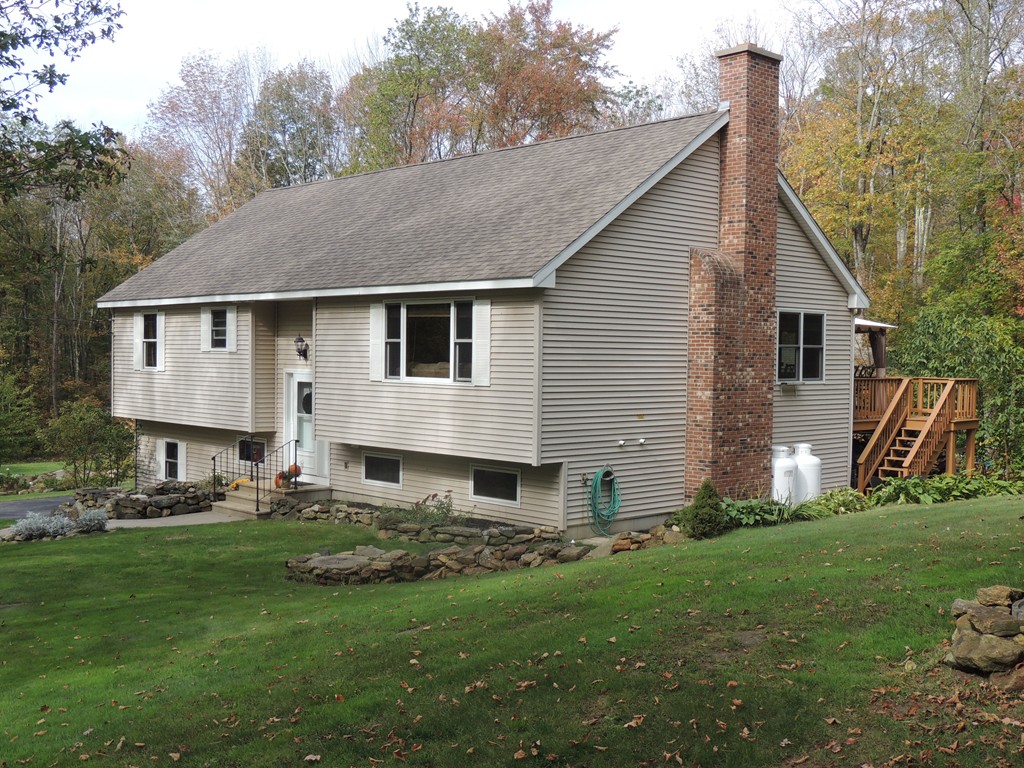 52 Ayers Road Monson, MA 01057 - Photo 4 of 25 a front view of house with yard and green space