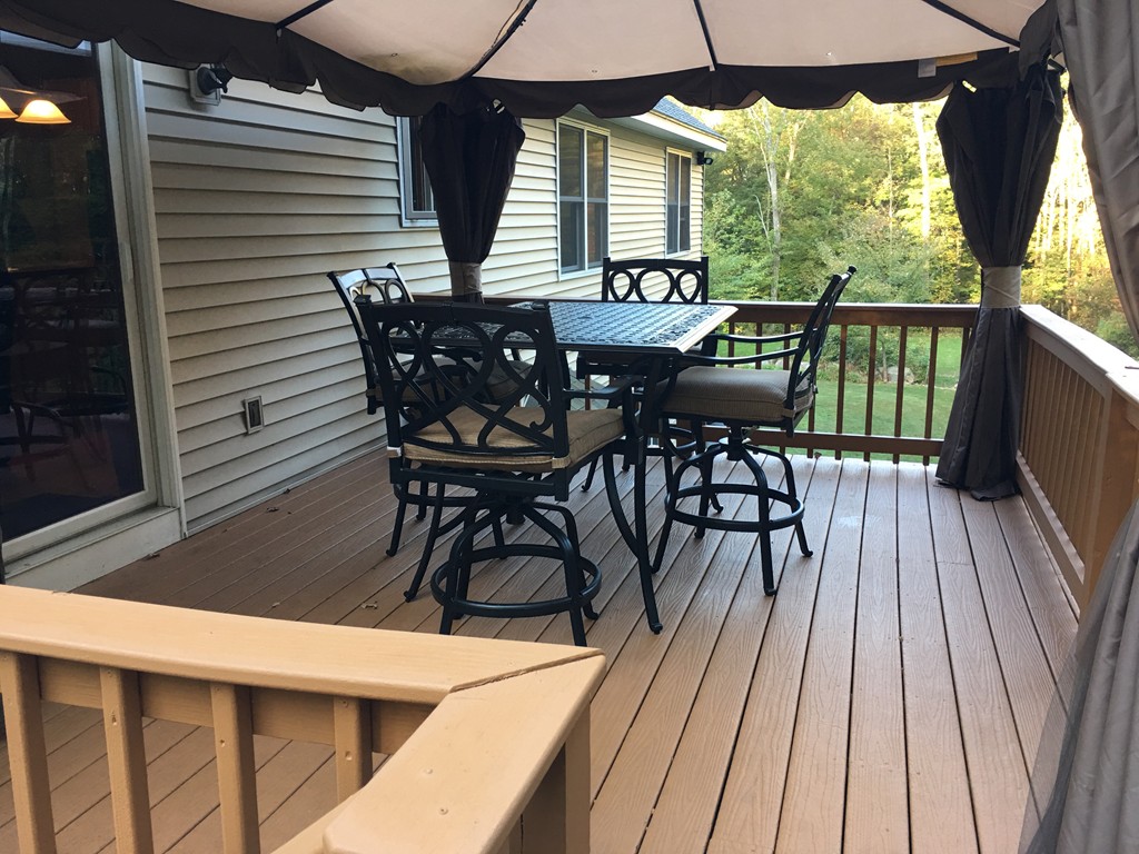 52 Ayers Road Monson, MA 01057 - Photo 7 of 25 a view of a patio with a table and chairs