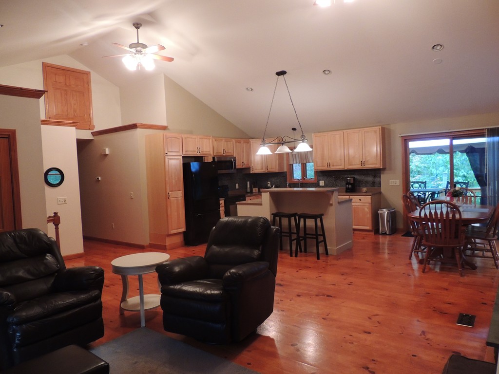 52 Ayers Road Monson, MA 01057 - Photo 9 of 25 a living room with furniture a dining table and a chandelier