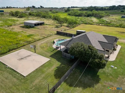 a view of a lake with a yard