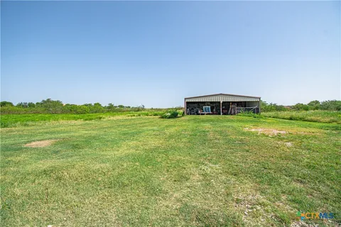 a view of a big room with table and chairs