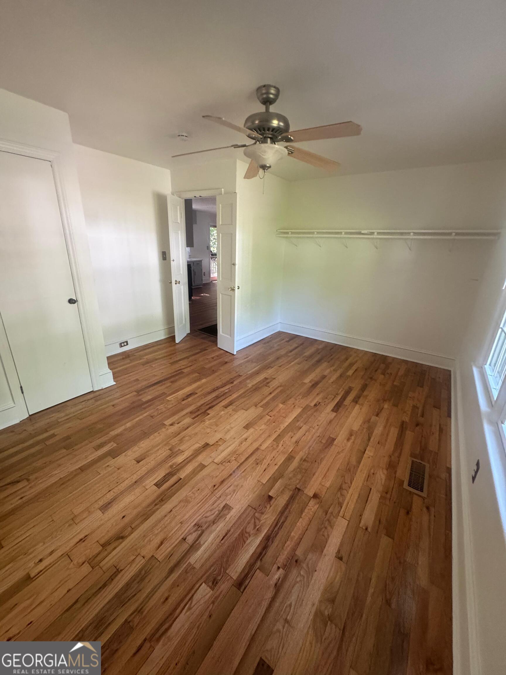 609 West Main Street Thomaston, GA 30286 - Photo 16 of 27 a view of empty room with wooden floor