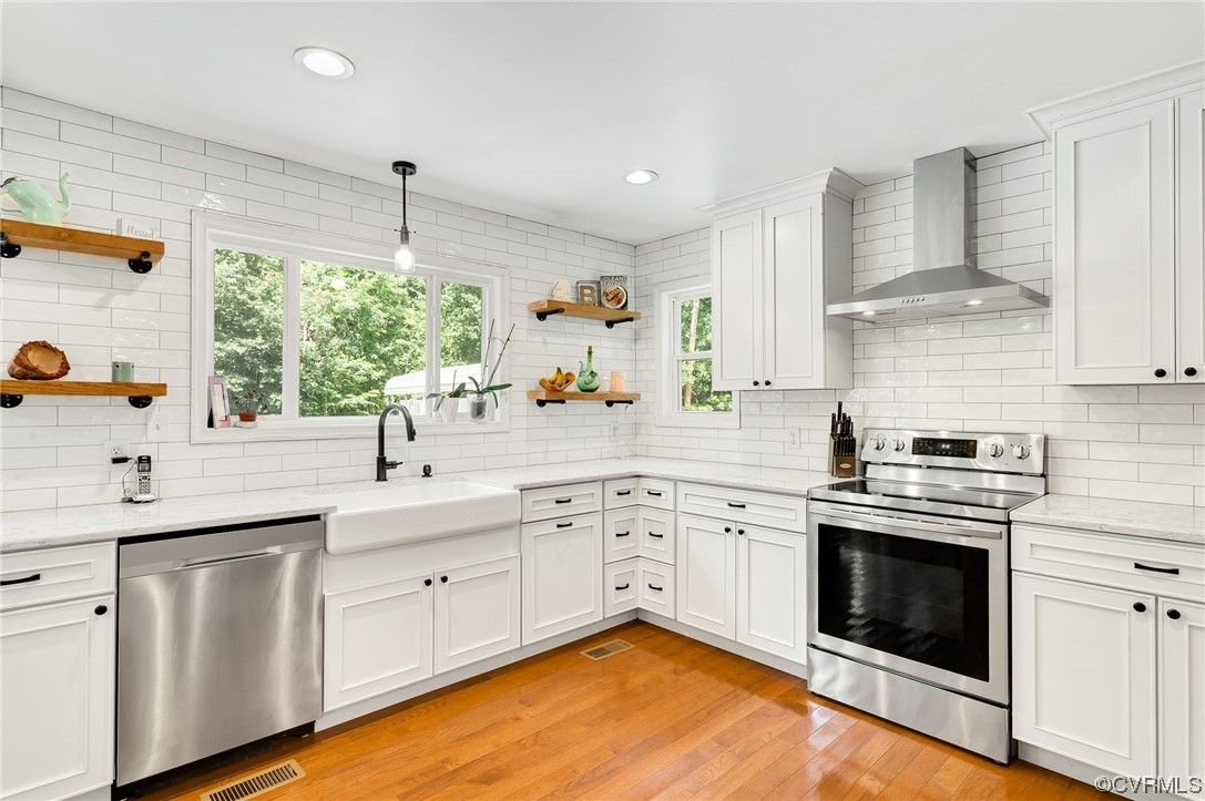3928 Whitehall Road Sandy Hook, VA 23153 - Photo 12 of 33 a kitchen with a sink stove and cabinets