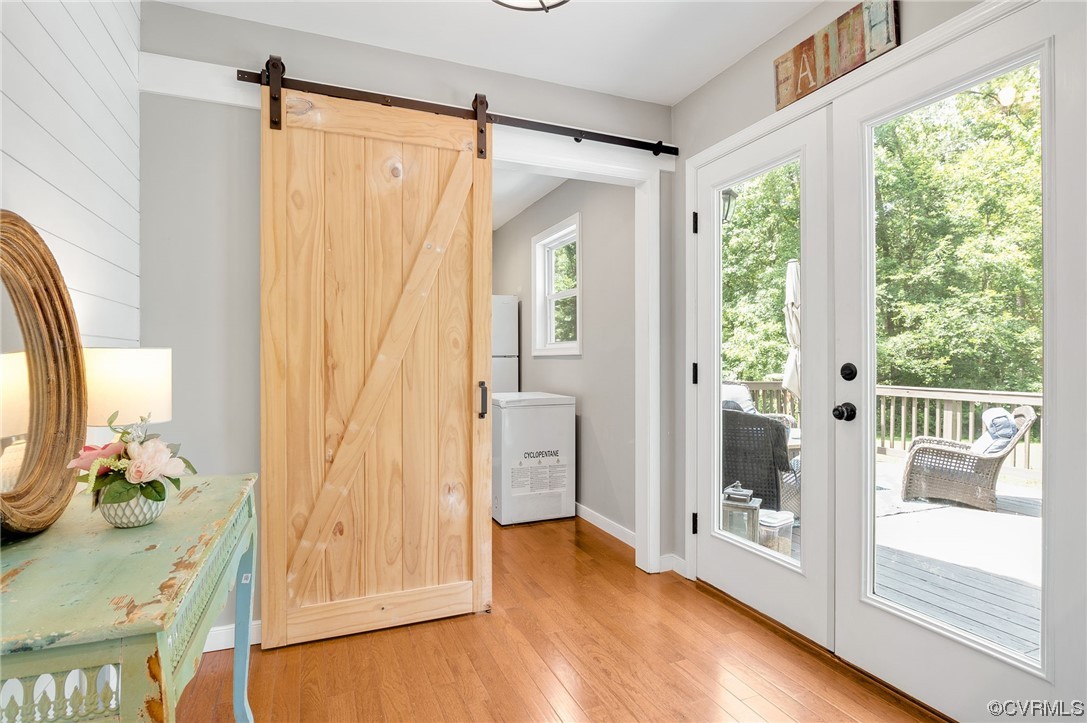3928 Whitehall Road Sandy Hook, VA 23153 - Photo 14 of 33 a view of walk in closet with wooden floor and furniture