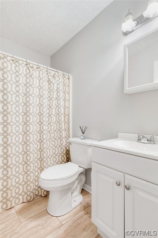 3928 Whitehall Road Sandy Hook, VA 23153 - Photo 23 of 33 a bathroom with a sink a toilet and a mirror