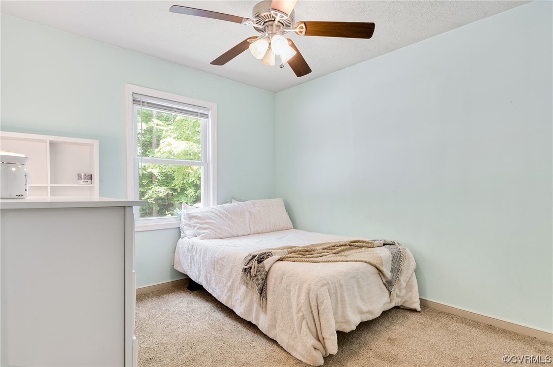 3928 Whitehall Road Sandy Hook, VA 23153 - Photo 24 of 33 a bedroom with a bed and window