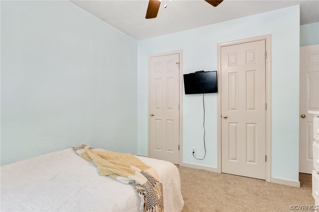 3928 Whitehall Road Sandy Hook, VA 23153 - Photo 25 of 33 a bedroom with a bed and a mirror