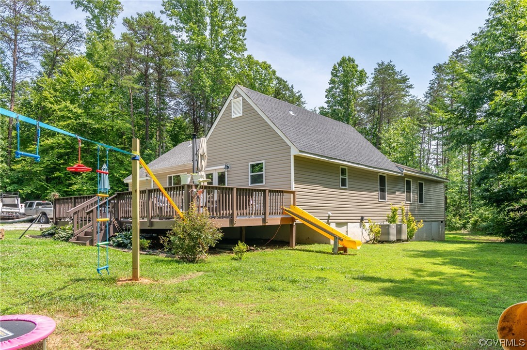 3928 Whitehall Road Sandy Hook, VA 23153 - Photo 28 of 33 a house that has a big yard and large trees