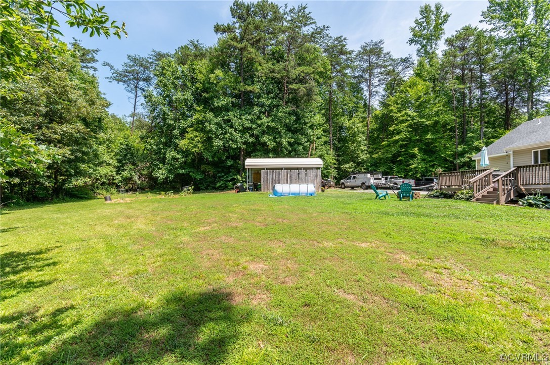 3928 Whitehall Road Sandy Hook, VA 23153 - Photo 29 of 33 a view of a house with a yard