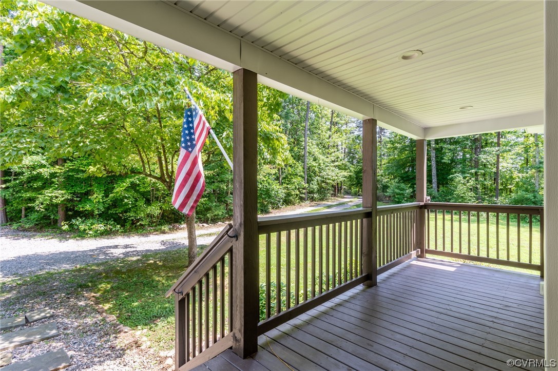 3928 Whitehall Road Sandy Hook, VA 23153 - Photo 3 of 33 a view of balcony with wooden floor and fence