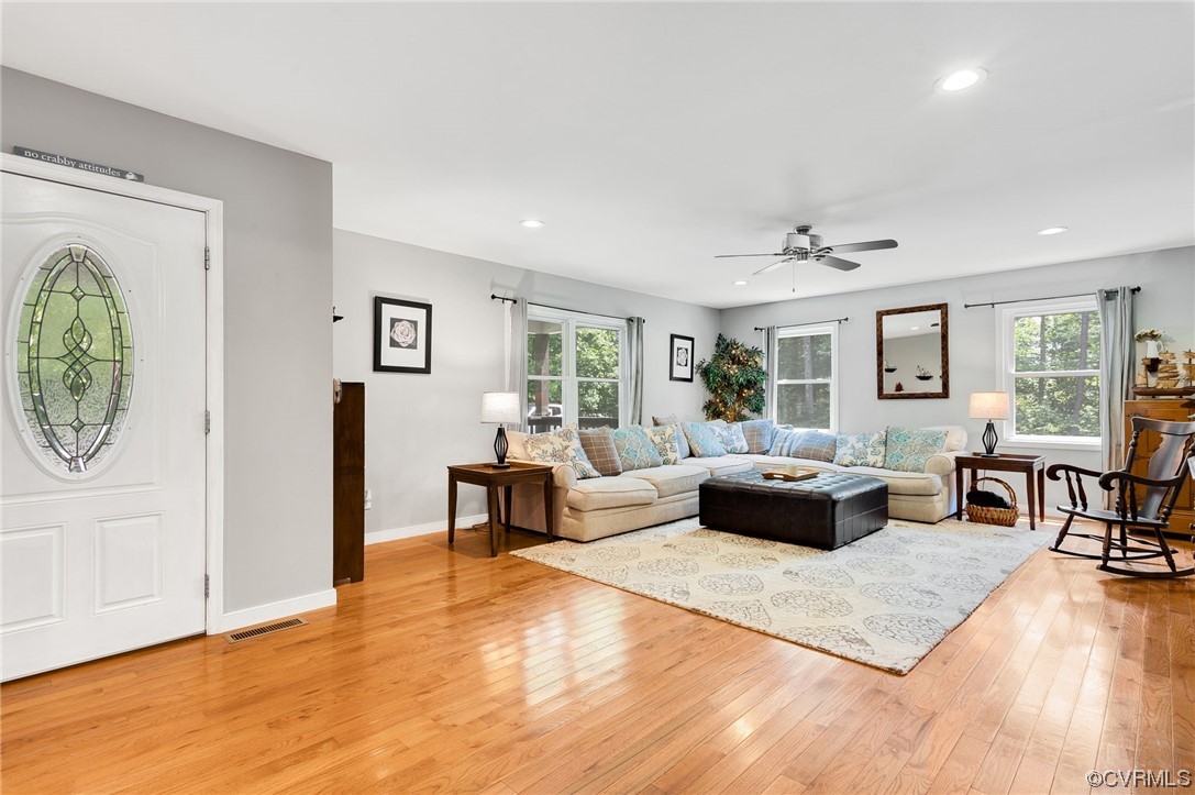 3928 Whitehall Road Sandy Hook, VA 23153 - Photo 5 of 33 a living room with furniture and a wooden floor