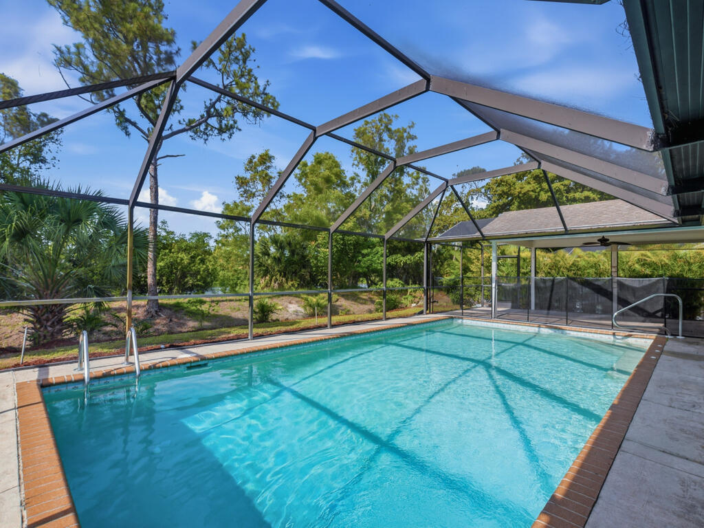 3650 Kent Drive Naples, FL 34112 - Photo 1 of 17 a view of a backyard with swimming pool