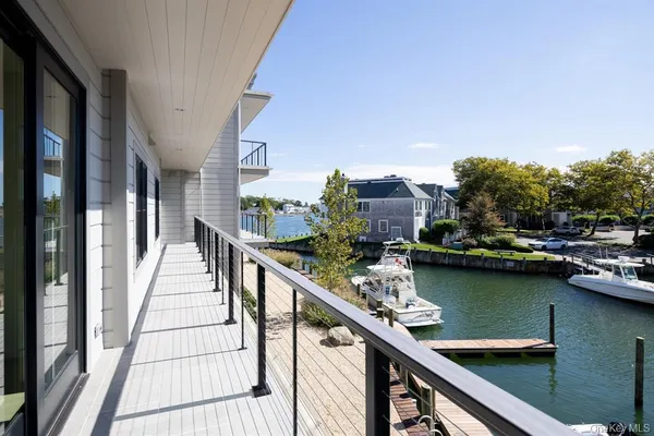 a view of a balcony with chairs