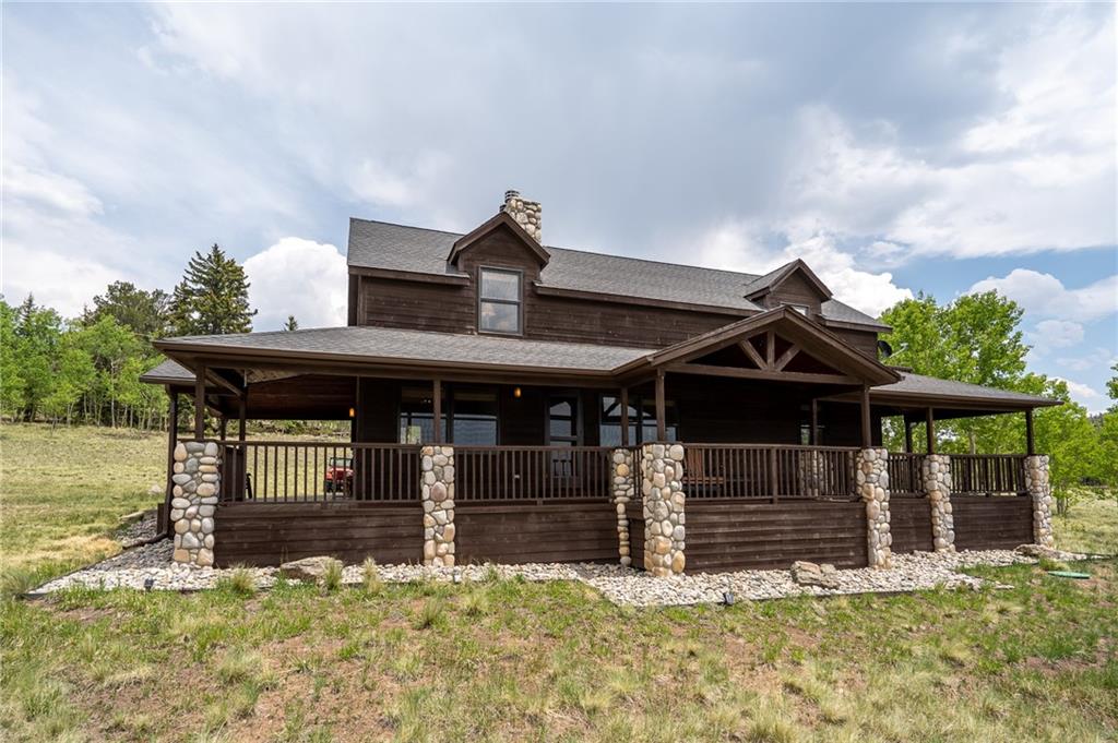 a view of a house with wooden fence