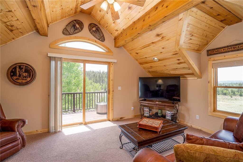 177 East Longbow Drive Como, CO 80456 - Photo 16 of 27 a living room with furniture a flat screen tv and a window