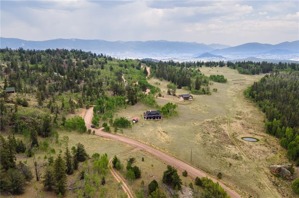 177 East Longbow Drive Como, CO 80456 - Photo 18 of 27 a view of a city with mountains in the background