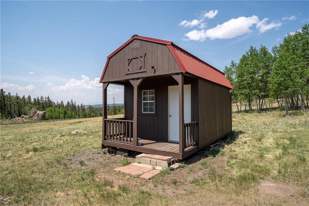 177 East Longbow Drive Como, CO 80456 - Photo 21 of 27 a front view of a house with a yard