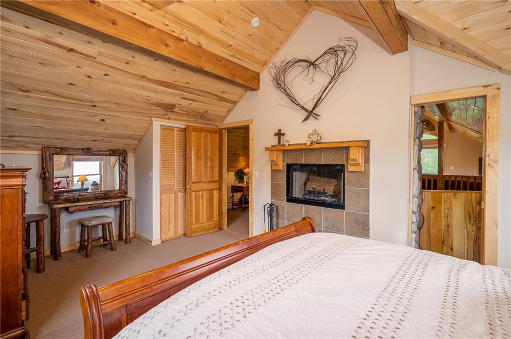 177 East Longbow Drive Como, CO 80456 - Photo 4 of 27 a bedroom with a bed and a television