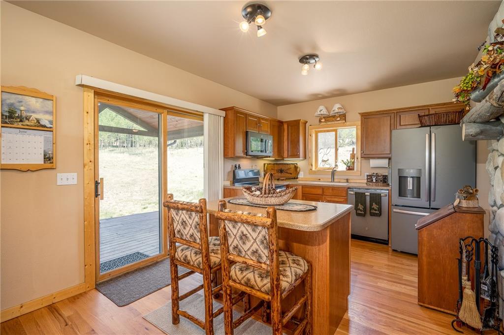 177 East Longbow Drive Como, CO 80456 - Photo 8 of 27 a very nice looking kitchen with a large window appliances and cabinets