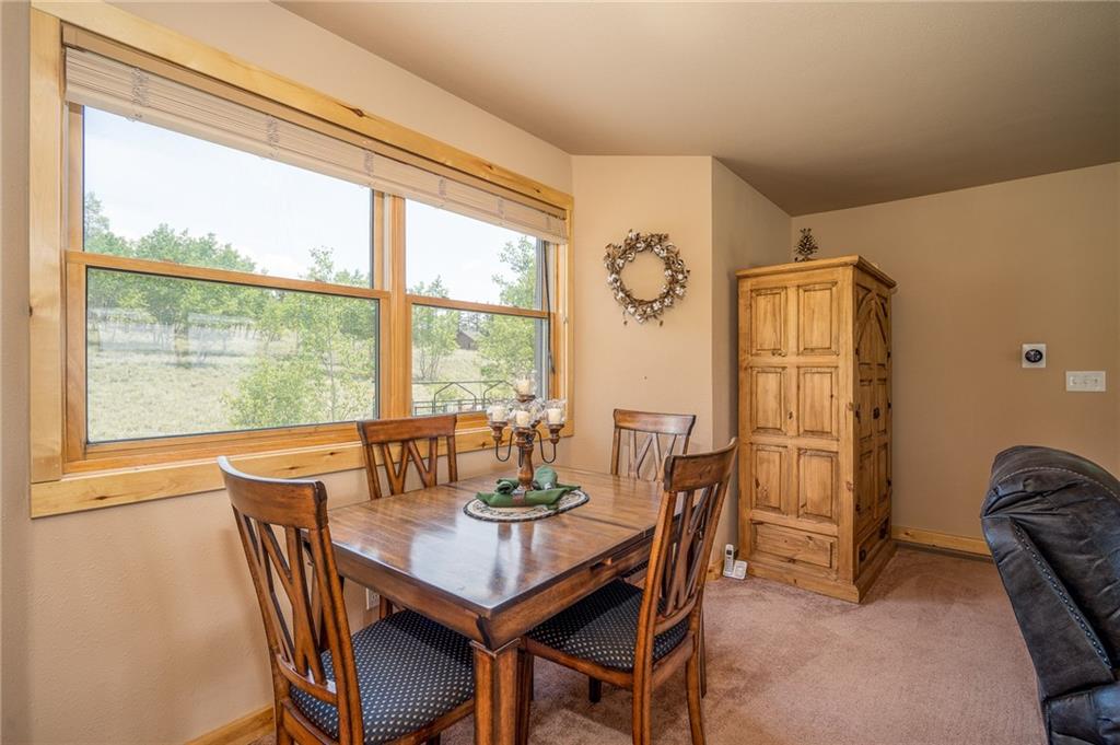 177 East Longbow Drive Como, CO 80456 - Photo 9 of 27 a view of a dining room with furniture window and outside view