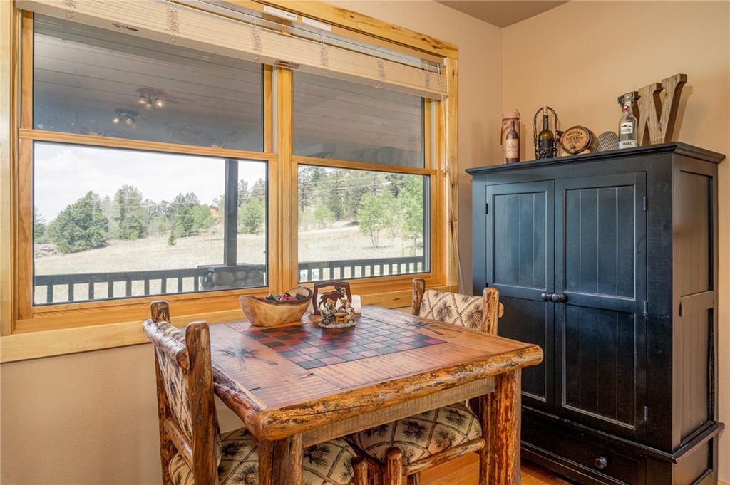 177 East Longbow Drive Como, CO 80456 - Photo 10 of 27 a dining room with furniture window and wooden floor