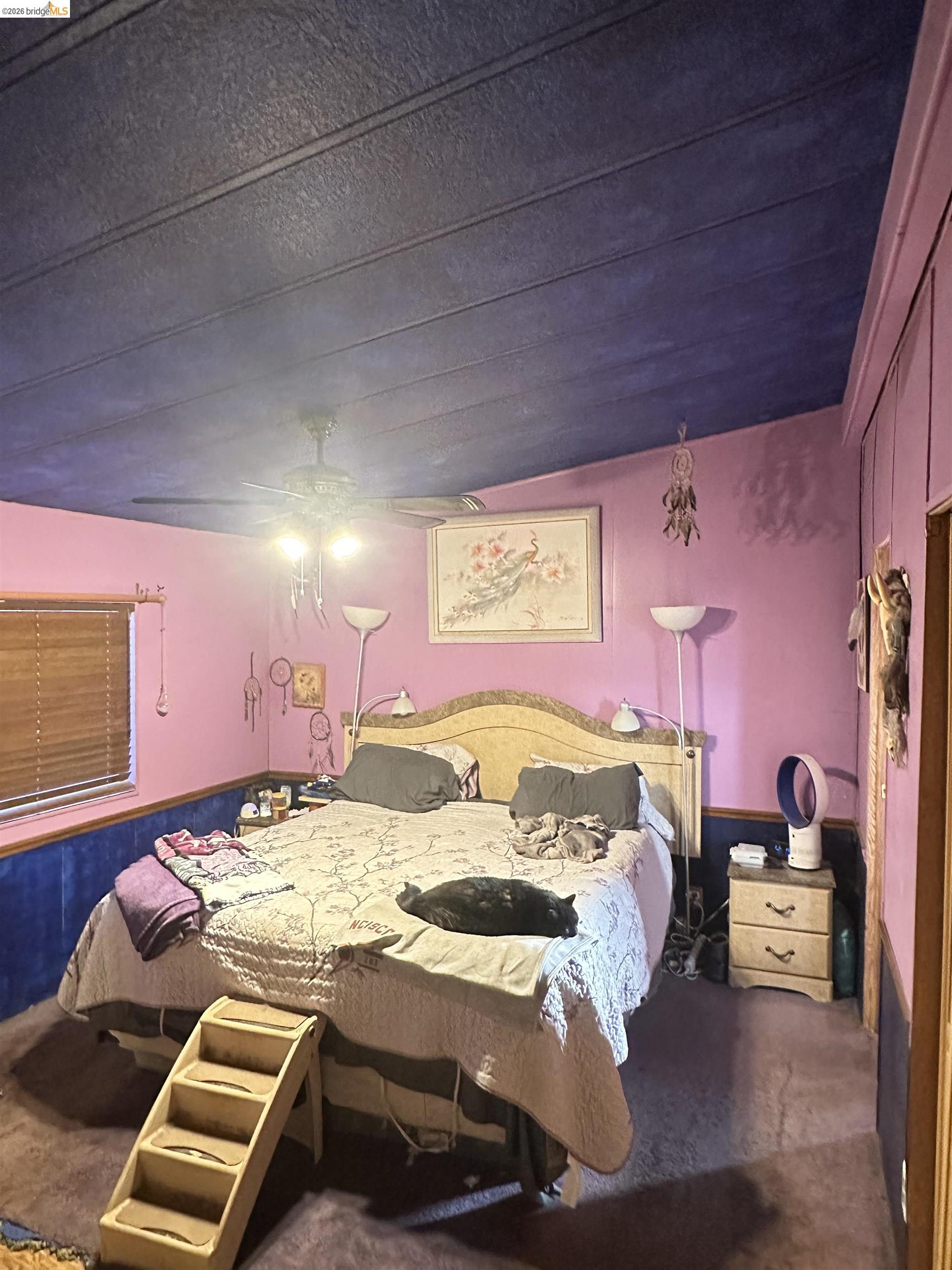 11761 Essen Lane Sonora, CA 95370 - Photo 13 of 20 a bedroom with a bed and a lamp