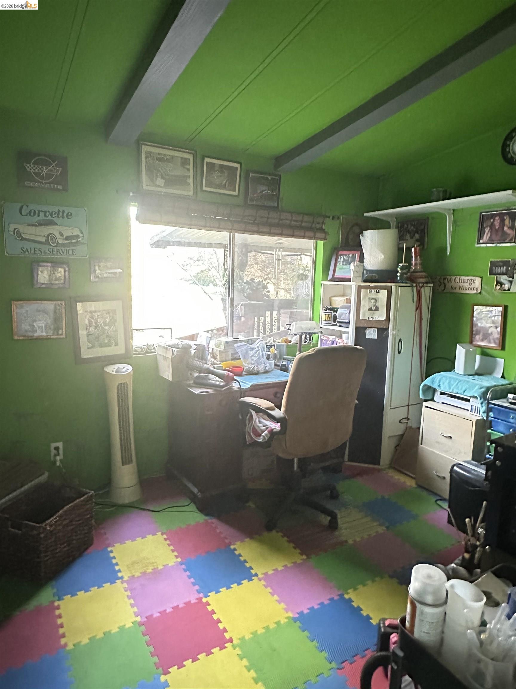 11761 Essen Lane Sonora, CA 95370 - Photo 17 of 20 a view of gym equipment with kitchen floor and a window