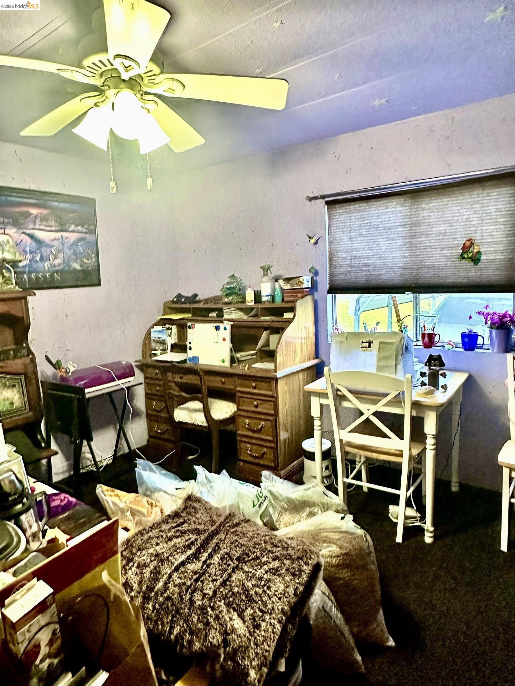 11761 Essen Lane Sonora, CA 95370 - Photo 20 of 20 a bedroom with a bed and a chandelier