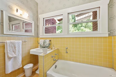 a bedroom with a bed and a lamp on table