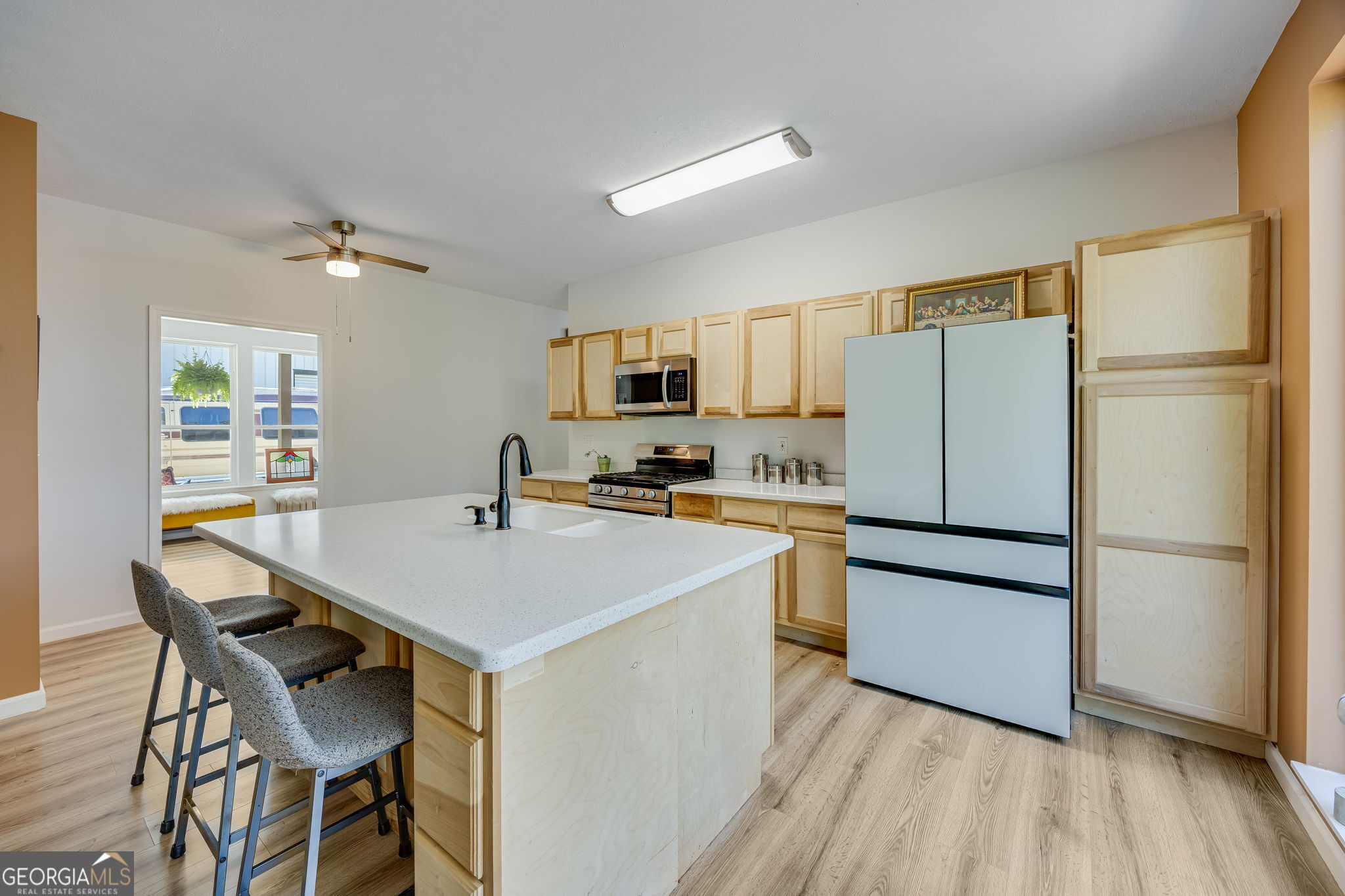 3114 Lake Ranch Drive Gainesville, GA 30506 - Photo 13 of 58 a kitchen with stainless steel appliances a refrigerator stove microwave and cabinets