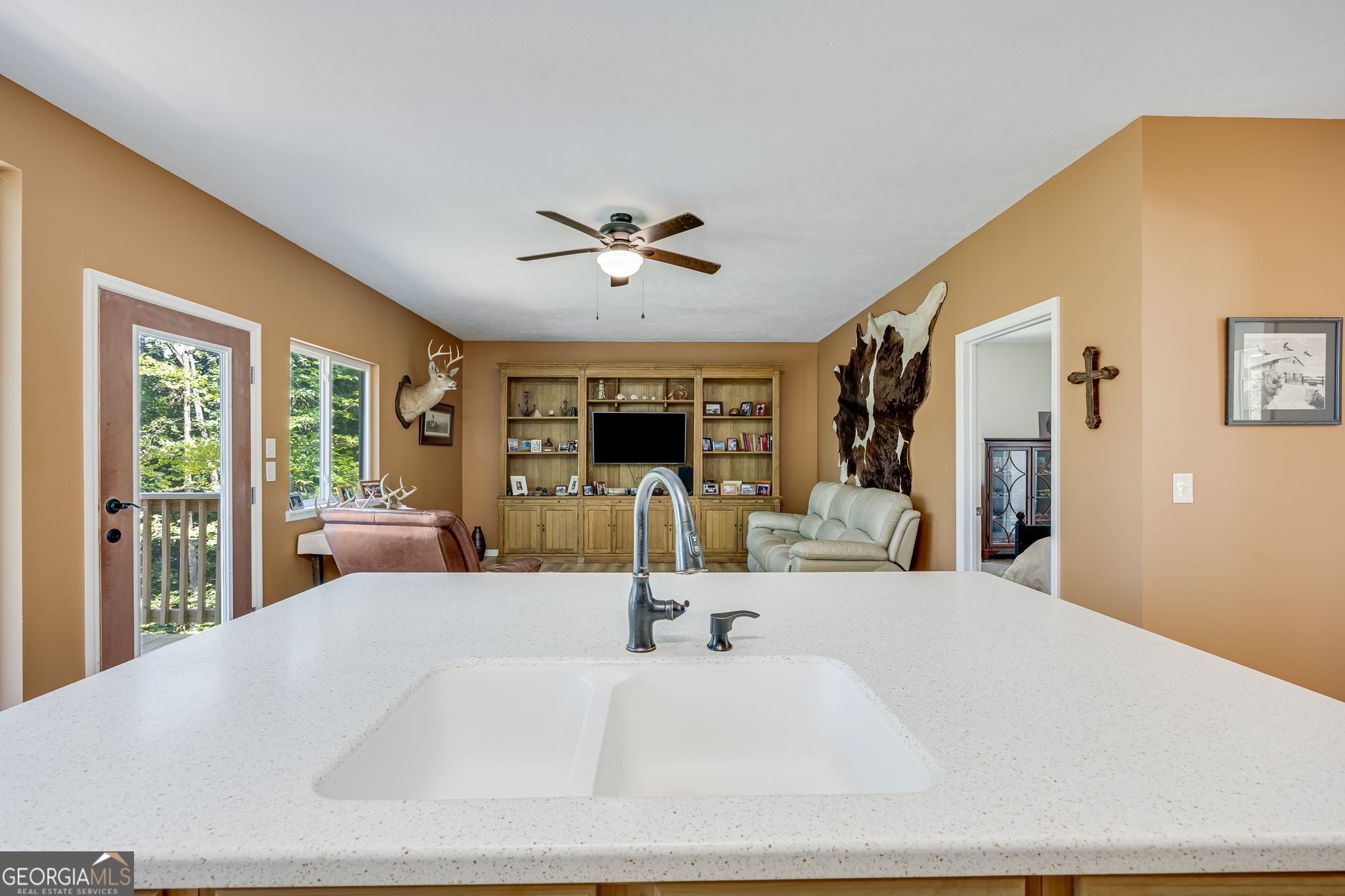 3114 Lake Ranch Drive Gainesville, GA 30506 - Photo 15 of 58 a large bedroom with a large bed and a chandelier