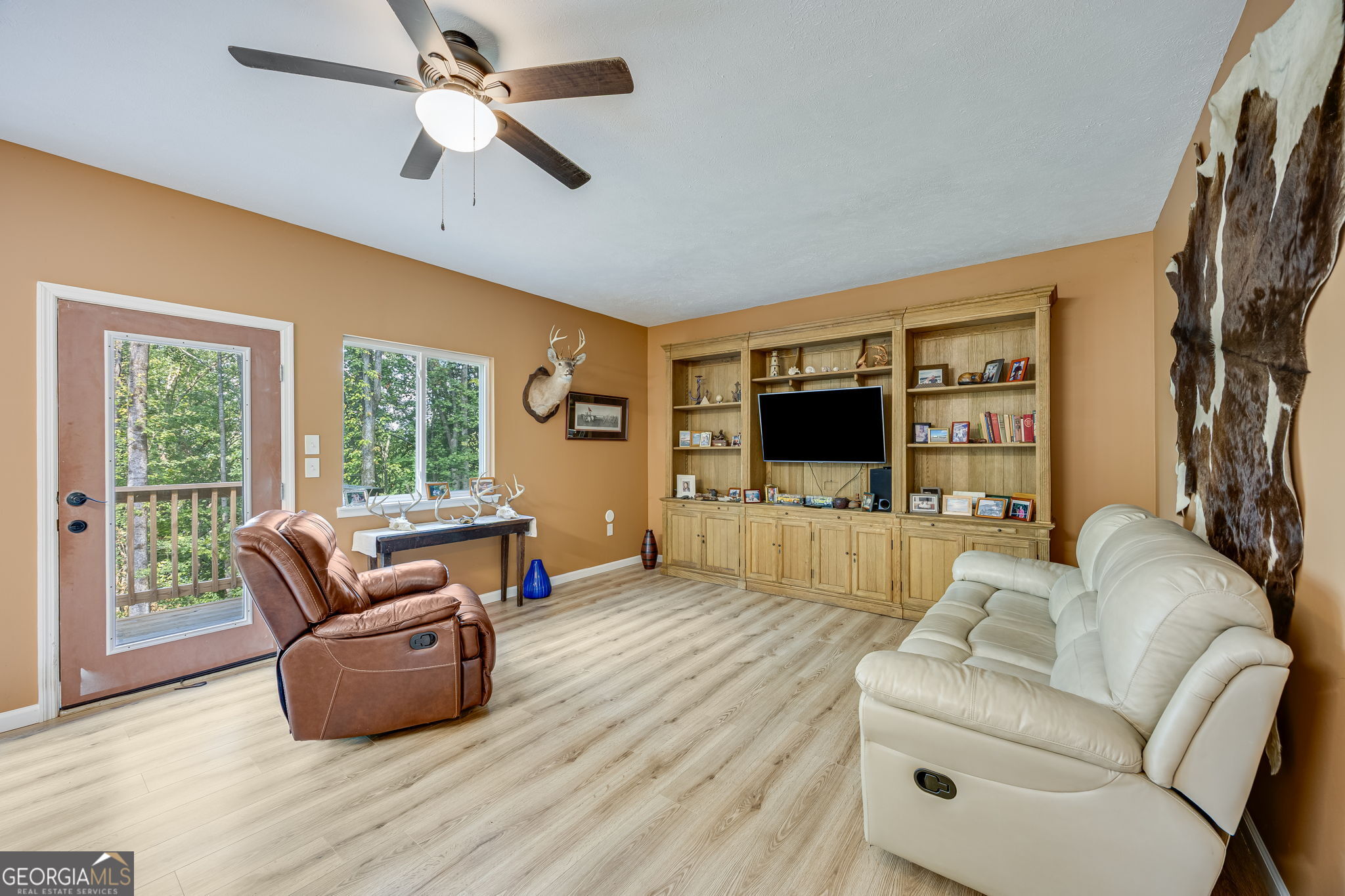 3114 Lake Ranch Drive Gainesville, GA 30506 - Photo 18 of 58 a living room with furniture flat screen tv and a large window