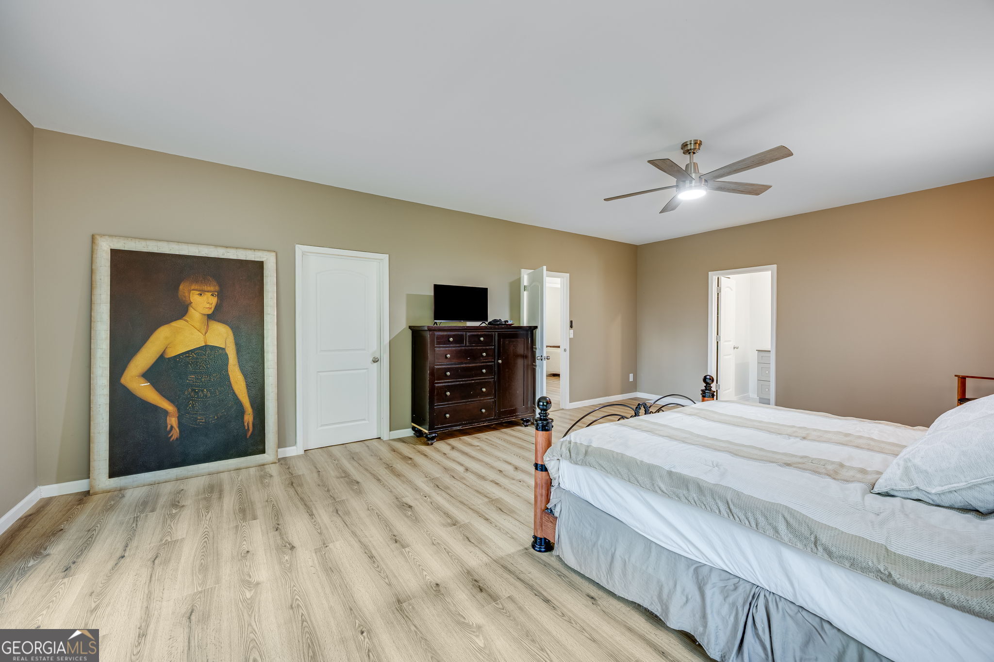 3114 Lake Ranch Drive Gainesville, GA 30506 - Photo 20 of 58 a bedroom with a bed and a flat screen tv