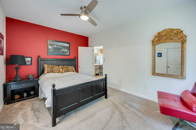 a bed room with a bed and a chair