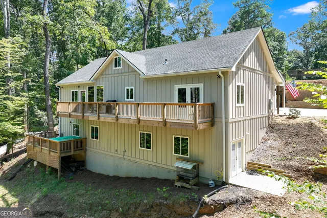 aerial view of a house with swimming pool and sitting area