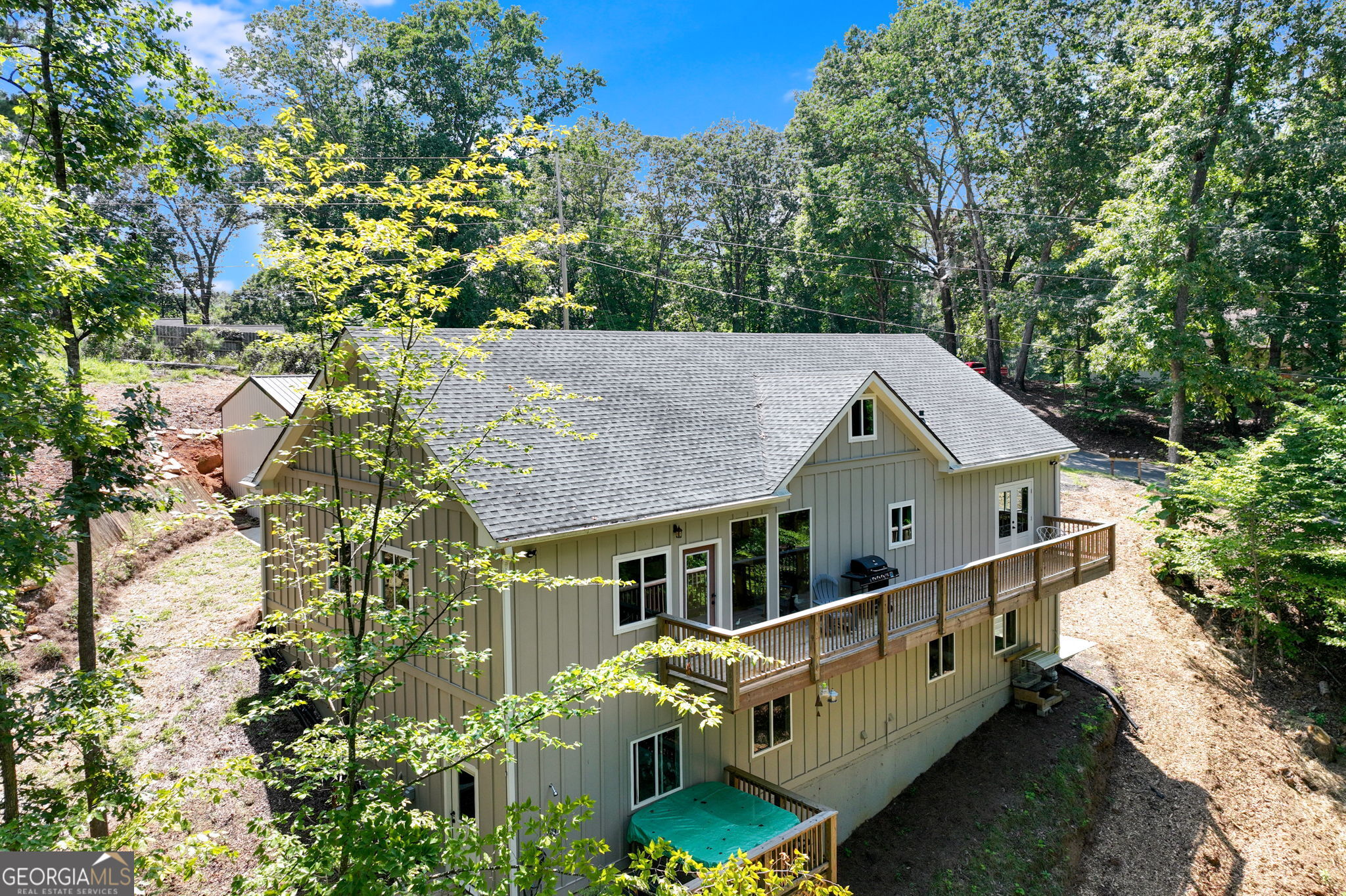 3114 Lake Ranch Drive Gainesville, GA 30506 - Photo 31 of 58 a roof deck with wooden fence and plants
