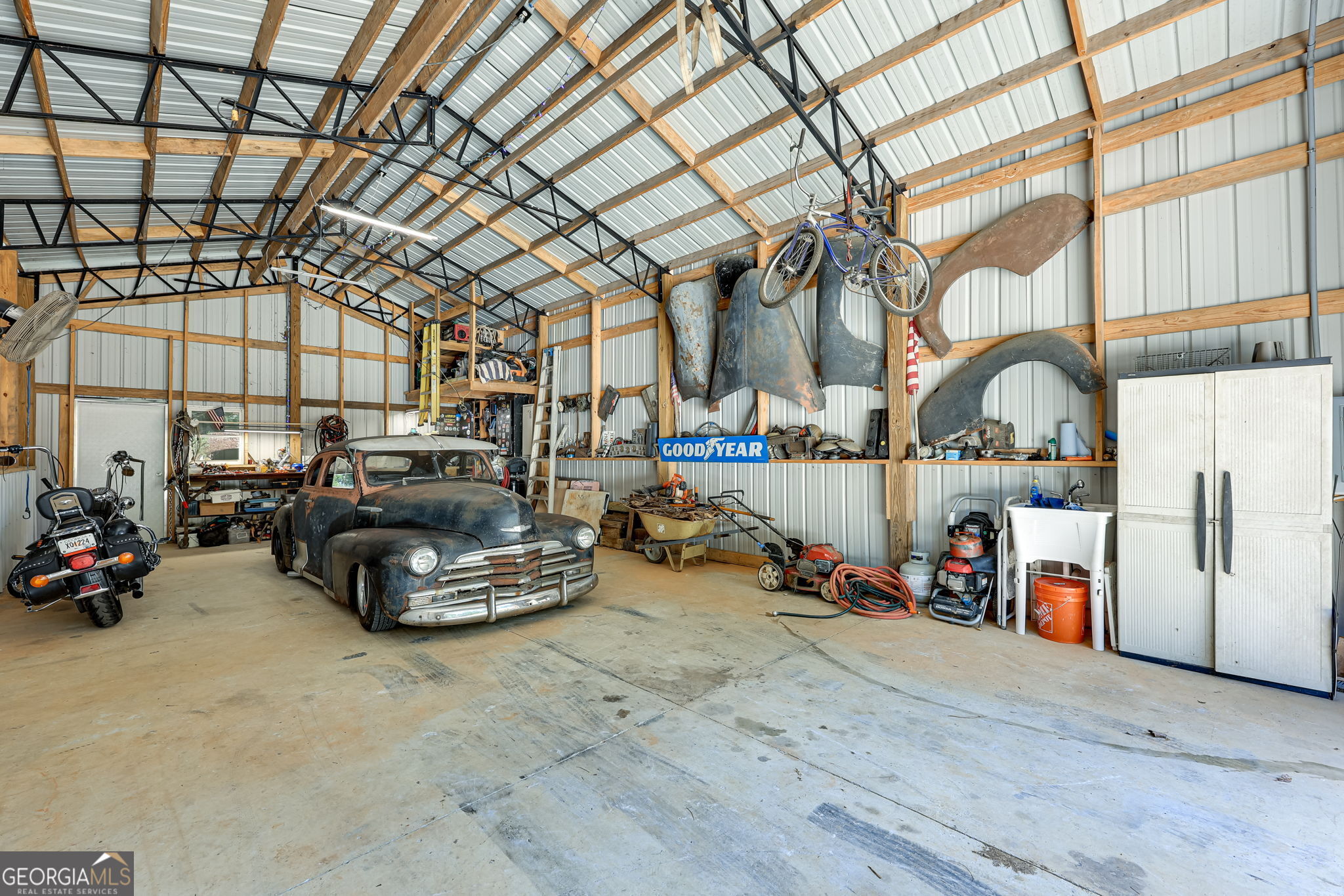 3114 Lake Ranch Drive Gainesville, GA 30506 - Photo 39 of 58 a room with lots of white furniture and a chandelier