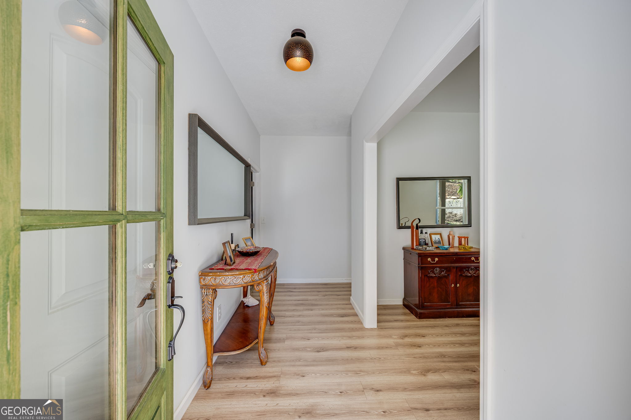 3114 Lake Ranch Drive Gainesville, GA 30506 - Photo 6 of 58 a view of a hallway with wooden floor and entryway