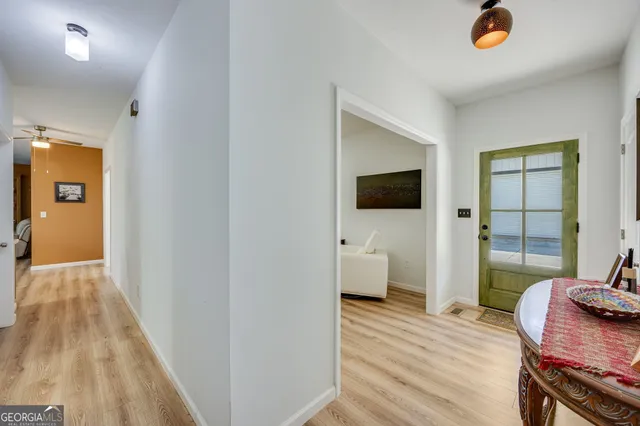 a view of a livingroom with furniture and a flat screen tv