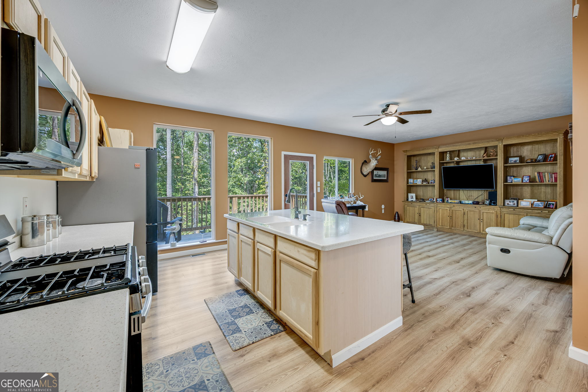 3114 Lake Ranch Drive Gainesville, GA 30506 - Photo 10 of 58 a kitchen with stainless steel appliances granite countertop a stove oven and a view of living room