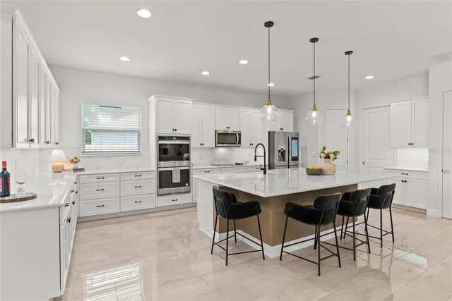 a bedroom with a bed couch and window