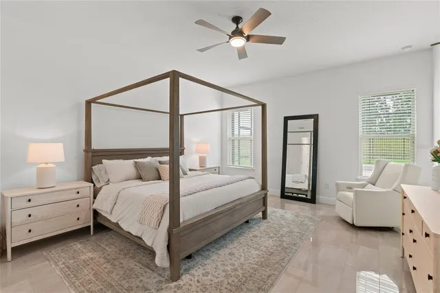 a bathroom with a double vanity sink mirror double and bathtub