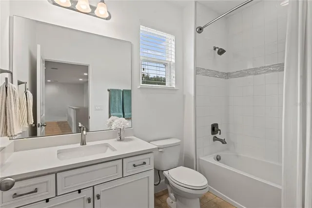 a view of a backyard with pool table and chairs
