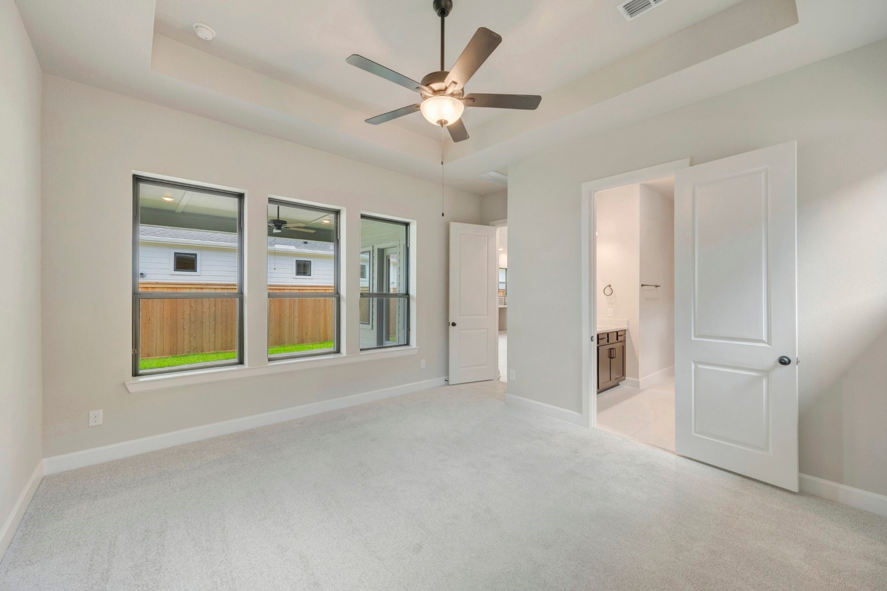 2722 Cottage Place Rosharon, TX 77583 - Photo 37 of 50 a view of an empty room with a window and a ceiling fan