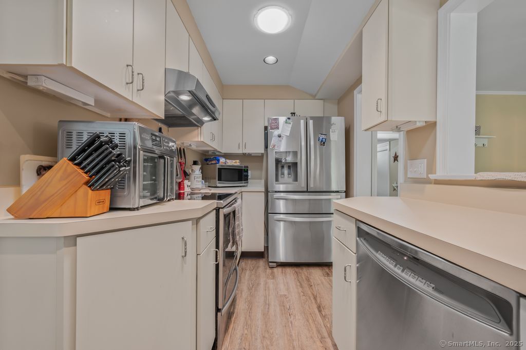 255 Dibble Hill Road Cornwall, CT 06796 - Photo 12 of 40 a kitchen with a refrigerator and a sink